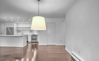 Experience modern elegance in this stunning top-floor condo on Pine Brook Golf Course in New Jersey - for sale on GolfHomes.com, golf home, golf lot