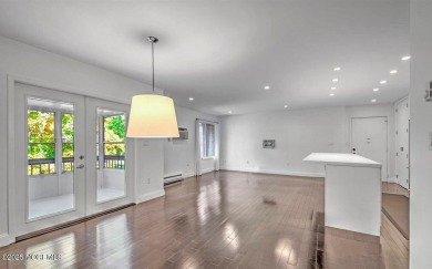 Experience modern elegance in this stunning top-floor condo on Pine Brook Golf Course in New Jersey - for sale on GolfHomes.com, golf home, golf lot