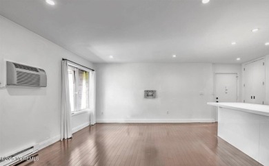 Experience modern elegance in this stunning top-floor condo on Pine Brook Golf Course in New Jersey - for sale on GolfHomes.com, golf home, golf lot