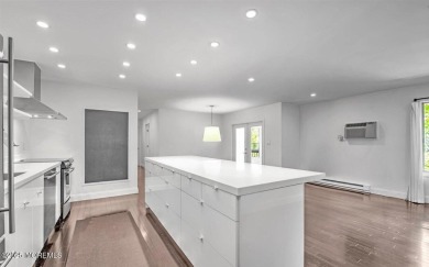 Experience modern elegance in this stunning top-floor condo on Pine Brook Golf Course in New Jersey - for sale on GolfHomes.com, golf home, golf lot