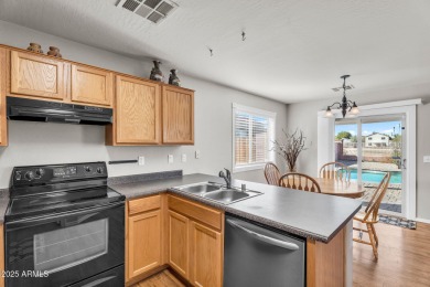 Recently painted inside and out! Beautiful Home with Heated Pool on Oasis Golf Club in Arizona - for sale on GolfHomes.com, golf home, golf lot