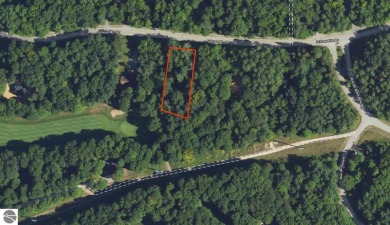 Nice wooded homesite behind the 3rd green of the Schuss Mountain on Schuss Mountain Golf Club in Michigan - for sale on GolfHomes.com, golf home, golf lot
