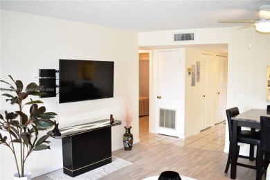 This furnished, turnkey, top floor condo features all new on Sunrise Lakes Phase III in Florida - for sale on GolfHomes.com, golf home, golf lot