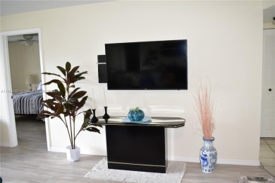 This furnished, turnkey, top floor condo features all new on Sunrise Lakes Phase III in Florida - for sale on GolfHomes.com, golf home, golf lot