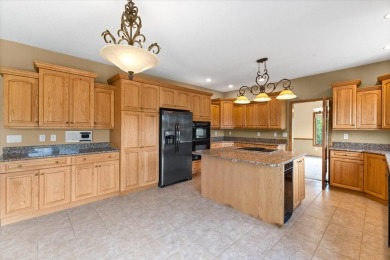 Enjoy golf course living in this spacious 4-bed, 3.5-bath on Ankeny Golf and Country Club in Iowa - for sale on GolfHomes.com, golf home, golf lot