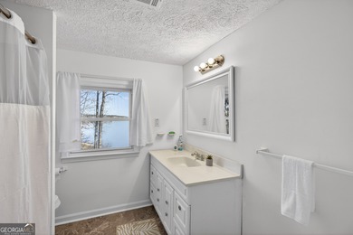 Lakefront Luxury Living with Stunning Views! This beautifully on Fairfield Plantation Golf and Country Club in Georgia - for sale on GolfHomes.com, golf home, golf lot