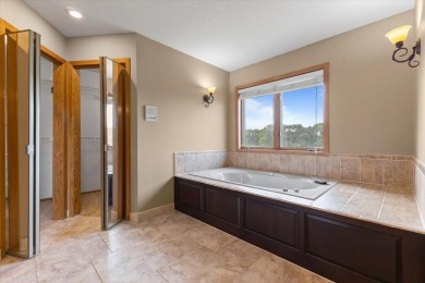 Enjoy golf course living in this spacious 4-bed, 3.5-bath on Ankeny Golf and Country Club in Iowa - for sale on GolfHomes.com, golf home, golf lot