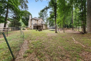 Tucked at the end of a quiet cul-de-sac and backing up to on Canongate At Eagle Watch Golf Club in Georgia - for sale on GolfHomes.com, golf home, golf lot