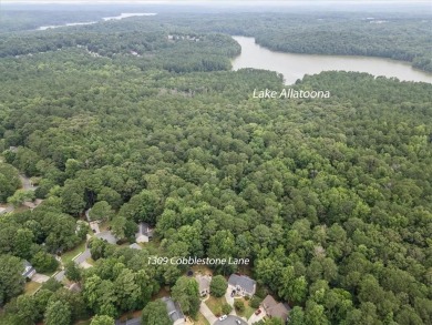 Tucked at the end of a quiet cul-de-sac and backing up to on Canongate At Eagle Watch Golf Club in Georgia - for sale on GolfHomes.com, golf home, golf lot