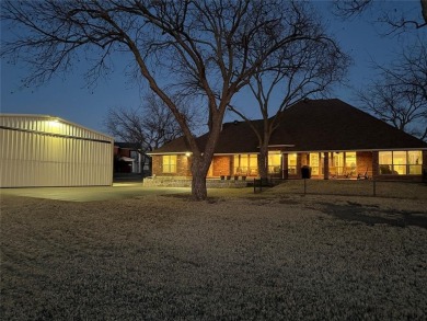 Rate takeoffs and landings from your back patio!  This lovely on Pecan Plantation Country Club in Texas - for sale on GolfHomes.com, golf home, golf lot