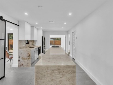 Experience luxury living in this fully remodeled golf course on Hollywood Beach Golf and Country Club in Florida - for sale on GolfHomes.com, golf home, golf lot