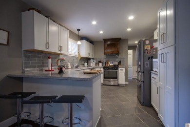 Charming, beautifully maintained 3-bedroom, 1.5-bath home is on Mayfield-Graves Country Club in Kentucky - for sale on GolfHomes.com, golf home, golf lot