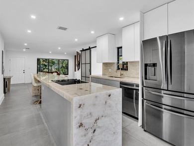 Experience luxury living in this fully remodeled golf course on Hollywood Beach Golf and Country Club in Florida - for sale on GolfHomes.com, golf home, golf lot