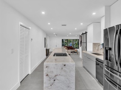 Experience luxury living in this fully remodeled golf course on Hollywood Beach Golf and Country Club in Florida - for sale on GolfHomes.com, golf home, golf lot