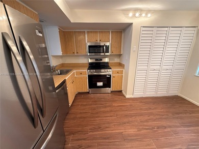 THIS BEAUTIFUL TWO BEDROOM TWO BATH CORNER UNIT, SPLIT BED ROOMS on Oriole Golf and Tennis Club in Florida - for sale on GolfHomes.com, golf home, golf lot