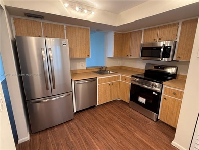 THIS BEAUTIFUL TWO BEDROOM TWO BATH CORNER UNIT, SPLIT BED ROOMS on Oriole Golf and Tennis Club in Florida - for sale on GolfHomes.com, golf home, golf lot