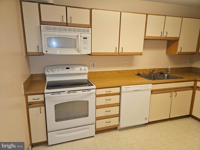 Nestled within the prestigious Greens at Leisure World, this on Leisure World Golf Club in Maryland - for sale on GolfHomes.com, golf home, golf lot