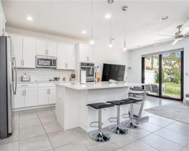 Modern townhouse located in the desirable gated community of on Boca Dunes Golf and Country Club in Florida - for sale on GolfHomes.com, golf home, golf lot