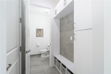Modern townhouse located in the desirable gated community of on Boca Dunes Golf and Country Club in Florida - for sale on GolfHomes.com, golf home, golf lot