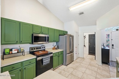 Beautiful and well-maintained 4-bedroom, 2-bath home located in on Palm Harbor Golf Club in Florida - for sale on GolfHomes.com, golf home, golf lot