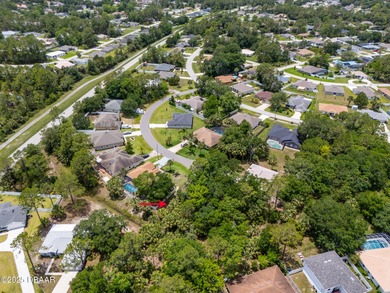 Tucked away at the end of a quiet cul-de-sac, this oversized on The Grand Club - Pine Lakes Course in Florida - for sale on GolfHomes.com, golf home, golf lot