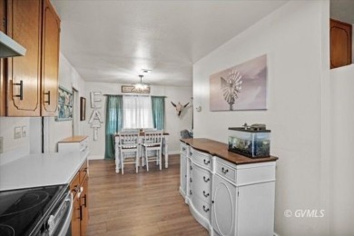 Run! Because this house is all that and a bag of chips! (If you on Mt. Graham Municipal Golf Course in Arizona - for sale on GolfHomes.com, golf home, golf lot