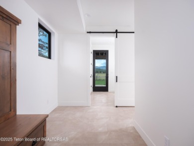 This brand-new custom home in Teton Reserve feels like a private on Teton Reserve in Idaho - for sale on GolfHomes.com, golf home, golf lot