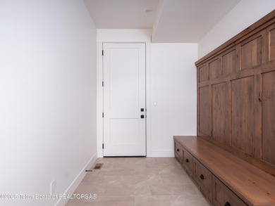 This brand-new custom home in Teton Reserve feels like a private on Teton Reserve in Idaho - for sale on GolfHomes.com, golf home, golf lot