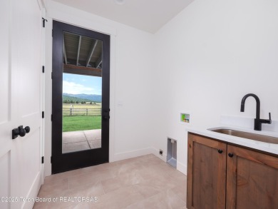 This brand-new custom home in Teton Reserve feels like a private on Teton Reserve in Idaho - for sale on GolfHomes.com, golf home, golf lot