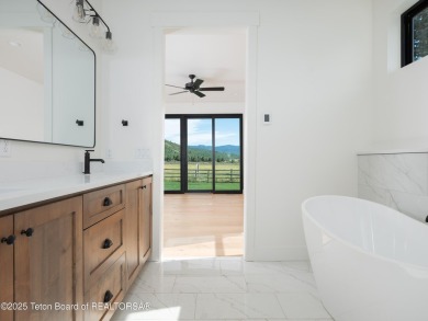 This brand-new custom home in Teton Reserve feels like a private on Teton Reserve in Idaho - for sale on GolfHomes.com, golf home, golf lot