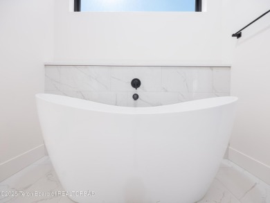This brand-new custom home in Teton Reserve feels like a private on Teton Reserve in Idaho - for sale on GolfHomes.com, golf home, golf lot