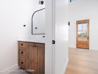 This brand-new custom home in Teton Reserve feels like a private on Teton Reserve in Idaho - for sale on GolfHomes.com, golf home, golf lot