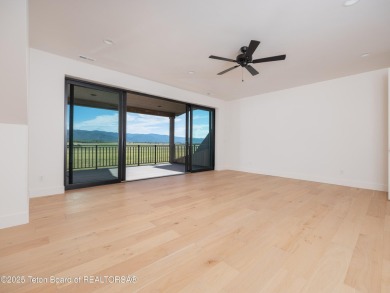 This brand-new custom home in Teton Reserve feels like a private on Teton Reserve in Idaho - for sale on GolfHomes.com, golf home, golf lot