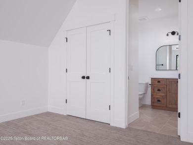 This brand-new custom home in Teton Reserve feels like a private on Teton Reserve in Idaho - for sale on GolfHomes.com, golf home, golf lot