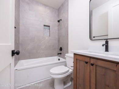 This brand-new custom home in Teton Reserve feels like a private on Teton Reserve in Idaho - for sale on GolfHomes.com, golf home, golf lot