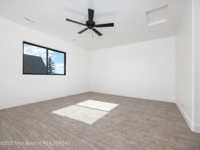 This brand-new custom home in Teton Reserve feels like a private on Teton Reserve in Idaho - for sale on GolfHomes.com, golf home, golf lot