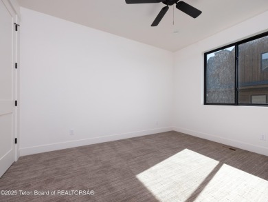 This brand-new custom home in Teton Reserve feels like a private on Teton Reserve in Idaho - for sale on GolfHomes.com, golf home, golf lot