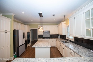 Welcome to 132 Pine Ridge Circle--an exceptional two-story home on Bay Pointe Golf and Resort in Mississippi - for sale on GolfHomes.com, golf home, golf lot