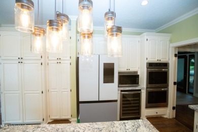 Welcome to 132 Pine Ridge Circle--an exceptional two-story home on Bay Pointe Golf and Resort in Mississippi - for sale on GolfHomes.com, golf home, golf lot