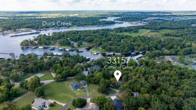 Surrounded by mature trees on a peaceful lot, this home blends on The Coves Golf Course in Oklahoma - for sale on GolfHomes.com, golf home, golf lot