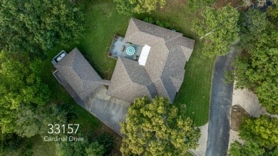 Surrounded by mature trees on a peaceful lot, this home blends on The Coves Golf Course in Oklahoma - for sale on GolfHomes.com, golf home, golf lot