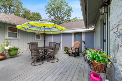 Surrounded by mature trees on a peaceful lot, this home blends on The Coves Golf Course in Oklahoma - for sale on GolfHomes.com, golf home, golf lot
