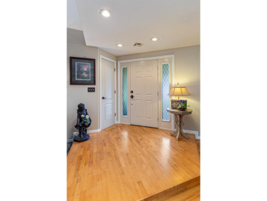 Surrounded by mature trees on a peaceful lot, this home blends on The Coves Golf Course in Oklahoma - for sale on GolfHomes.com, golf home, golf lot