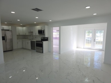 Step into luxury! This fully remodeled 4-bed, 2-bath stunner on Forest Oaks Golf Club in Florida - for sale on GolfHomes.com, golf home, golf lot