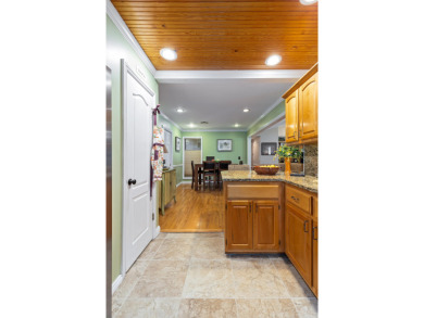 Surrounded by mature trees on a peaceful lot, this home blends on The Coves Golf Course in Oklahoma - for sale on GolfHomes.com, golf home, golf lot