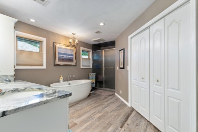 Surrounded by mature trees on a peaceful lot, this home blends on The Coves Golf Course in Oklahoma - for sale on GolfHomes.com, golf home, golf lot