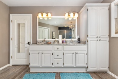 Surrounded by mature trees on a peaceful lot, this home blends on The Coves Golf Course in Oklahoma - for sale on GolfHomes.com, golf home, golf lot