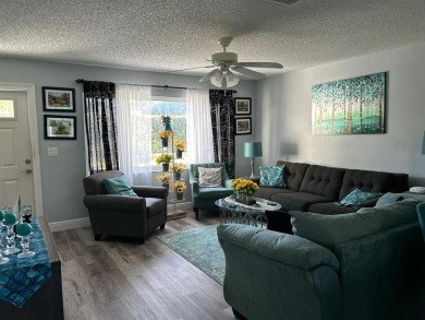 Discover refined living in Leisureville, Boynton Beach's premier on Leisureville Community Golf Course in Florida - for sale on GolfHomes.com, golf home, golf lot
