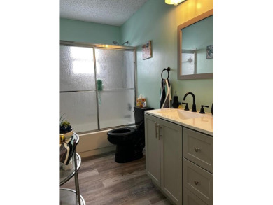 Discover refined living in Leisureville, Boynton Beach's premier on Leisureville Community Golf Course in Florida - for sale on GolfHomes.com, golf home, golf lot