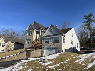 This Colonial is over 4000 square feet and located on the golf on Country Club of the Poconos Golf Course in Pennsylvania - for sale on GolfHomes.com, golf home, golf lot